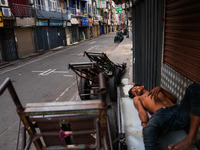 A man sleeps on the cart in Colombo, Sri Lanka, on September 22, 2024. A curfew is imposed in Sri Lanka amid the counting of votes in the pr...