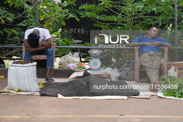 Vendors sleep during the curfew in Colombo, Sri Lanka, on September 22, 2024. Curfew is imposed in Sri Lanka amid the counting of votes in t...