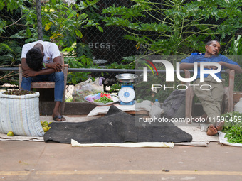 Vendors sleep during the curfew in Colombo, Sri Lanka, on September 22, 2024. Curfew is imposed in Sri Lanka amid the counting of votes in t...