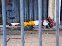 Vendors sleep during the curfew in Colombo, Sri Lanka, on September 22, 2024. Curfew is imposed in Sri Lanka amid the counting of votes in t...