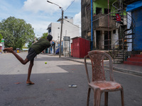 Kids play cricket during the curfew in Colombo, Sri Lanka, on September 22, 2024. The curfew is imposed in Sri Lanka amid the counting of vo...