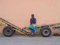 A laborer sits at the cart in Colombo, Sri Lanka, on September 22, 2024. A curfew is imposed in Sri Lanka amid the counting of votes in the...