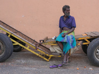 A laborer sits at the cart in Colombo, Sri Lanka, on September 22, 2024. A curfew is imposed in Sri Lanka amid the counting of votes in the...