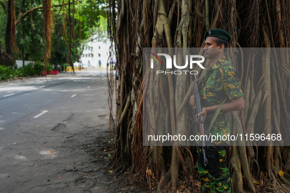 A soldier stands guard at the road in Colombo, Sri Lanka, on September 22, 2024. A curfew is imposed in Sri Lanka amid the counting of votes...