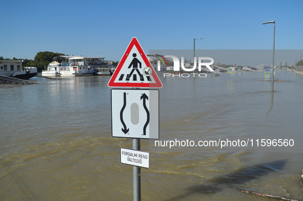 A traffic sign is submerged on the bank of the Danube in Budapest, Hungary, as the peak water levels of the Danube are expected to hit today...