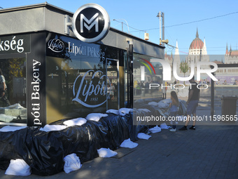 A metro station is closed and covered by sandbags on the bank of the Danube in Budapest, Hungary, as the peak water levels of the Danube are...