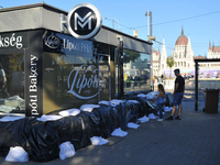 A metro station is closed and covered by sandbags on the bank of the Danube in Budapest, Hungary, as the peak water levels of the Danube are...