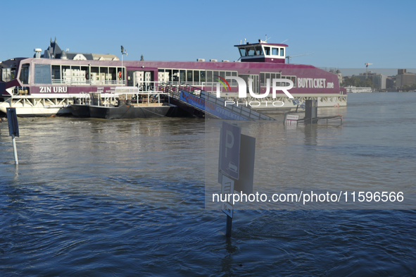 Traffic signs are underwater on the bank of the Danube in Budapest, Hungary, as the peak water levels of the Danube are expected to hit toda...