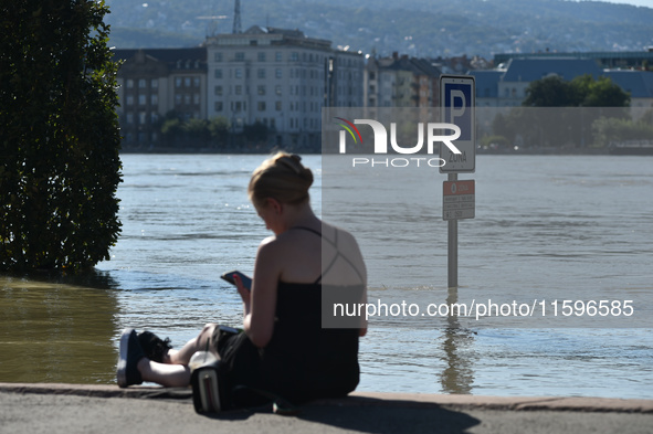 A flooded traffic sign stands on the bank of the Danube in Budapest, Hungary, as the peak water levels of the Danube are expected to hit tod...