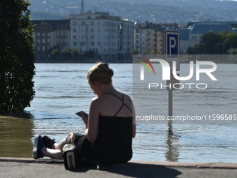 A flooded traffic sign stands on the bank of the Danube in Budapest, Hungary, as the peak water levels of the Danube are expected to hit tod...