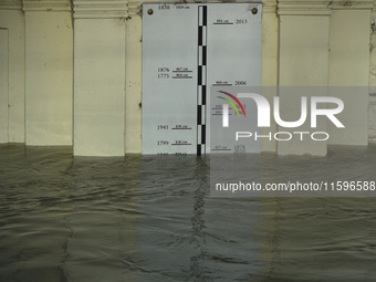 A board shows historic water heights on the bank of the Danube in Budapest, Hungary, as the peak water levels of the Danube are expected to...