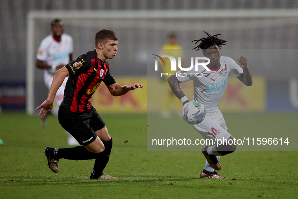 Oluwatobiloba Dimeji Awosanya (R) of Balzan competes for the ball with Sven Xerri (L) of Hamrun Spartans during the Malta 360 Sports Premier...