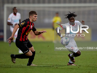 Oluwatobiloba Dimeji Awosanya (R) of Balzan competes for the ball with Sven Xerri (L) of Hamrun Spartans during the Malta 360 Sports Premier...