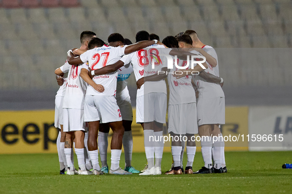 Soccer players from Balzan huddle up prior to the Malta 360 Sports Premier League soccer match between Balzan and Hamrun Spartans at the Nat...