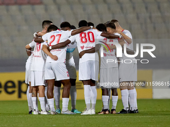 Soccer players from Balzan huddle up prior to the Malta 360 Sports Premier League soccer match between Balzan and Hamrun Spartans at the Nat...