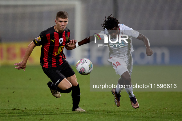 Oluwatobiloba Dimeji Awosanya (R) of Balzan competes for the ball with Sven Xerri (L) of Hamrun Spartans during the Malta 360 Sports Premier...