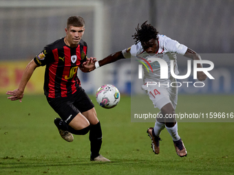 Oluwatobiloba Dimeji Awosanya (R) of Balzan competes for the ball with Sven Xerri (L) of Hamrun Spartans during the Malta 360 Sports Premier...