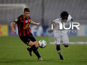 Oluwatobiloba Dimeji Awosanya (R) of Balzan competes for the ball with Sven Xerri (L) of Hamrun Spartans during the Malta 360 Sports Premier...