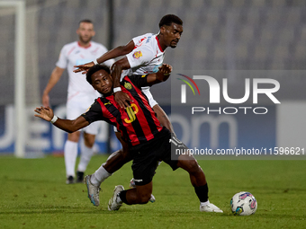 Joseph Mbong of Hamrun Spartans competes for the ball with Udoyen Alexander Ayo Akpan of Balzan during the Malta 360 Sports Premier League s...