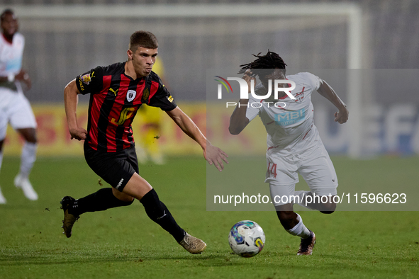 Oluwatobiloba Dimeji Awosanya (R) of Balzan competes for the ball with Sven Xerri (L) of Hamrun Spartans during the Malta 360 Sports Premier...