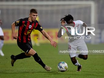 Oluwatobiloba Dimeji Awosanya (R) of Balzan competes for the ball with Sven Xerri (L) of Hamrun Spartans during the Malta 360 Sports Premier...