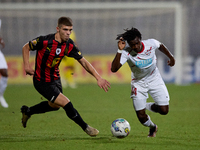 Oluwatobiloba Dimeji Awosanya (R) of Balzan competes for the ball with Sven Xerri (L) of Hamrun Spartans during the Malta 360 Sports Premier...