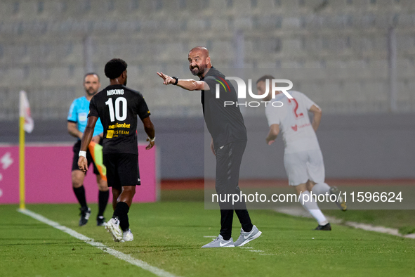 Dave Rogers, head coach of Balzan, gestures during the Malta 360 Sports Premier League soccer match between Balzan and Hamrun Spartans at th...