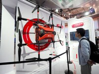 Visitors visit the ''Unmanned Delivery System - Drones'' at JD Logistics' booth at the 16th International Transportation Technology and Equi...