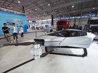 Visitors visit the ''Xiaopeng Pure Electric Flying Car'' at the 16th International Transportation Technology and Equipment Exhibition in Bei...