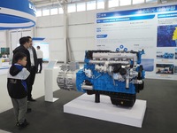 Visitors view a ''methanol engine'' at the 16th International Transportation Technology and Equipment Exhibition in Beijing, China, on Septe...