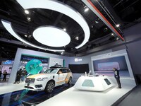 Visitors visit the booth of Didi at the 16th International Transportation Technology and Equipment Exhibition in Beijing, China, on Septembe...