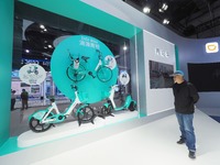 Visitors visit a ''Didi Qingjiu shared electric bike'' at the 16th International Transportation Technology and Equipment Exhibition in Beiji...