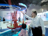 Visitors visit the ''Daqiaohaifeng'' wind power installation ship at the 16th International Transportation Technology and Equipment Exhibiti...