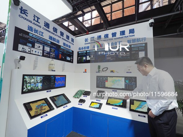 Visitors visit the ''AIS Ship Automatic Identification System'' at the 16th International Transport Technology and Equipment Exhibition in B...