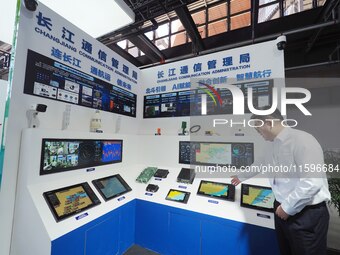 Visitors visit the ''AIS Ship Automatic Identification System'' at the 16th International Transport Technology and Equipment Exhibition in B...