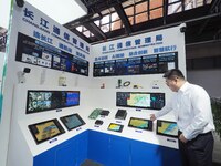 Visitors visit the ''AIS Ship Automatic Identification System'' at the 16th International Transport Technology and Equipment Exhibition in B...