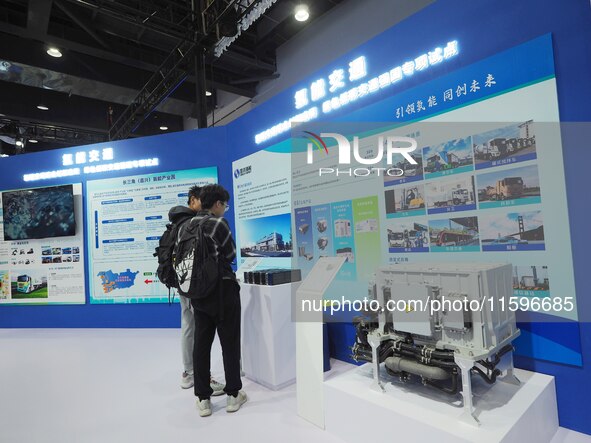 Visitors look at the ''Hydrogen Transportation System'' at the 16th International Transportation Technology and Equipment Exhibition in Beij...