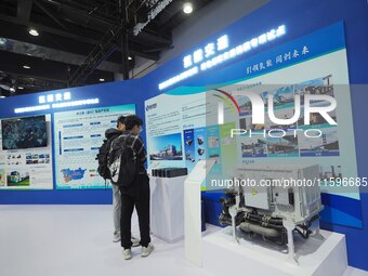 Visitors look at the ''Hydrogen Transportation System'' at the 16th International Transportation Technology and Equipment Exhibition in Beij...