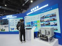 Visitors look at the ''Hydrogen Transportation System'' at the 16th International Transportation Technology and Equipment Exhibition in Beij...