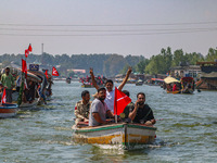 Indian security personnel patrol in a boat during an election rally at Dal Lake, ahead of the second phase of voting during the assembly ele...