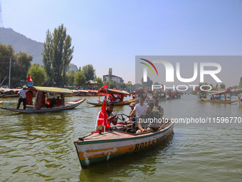 Indian security personnel patrol in a boat during an election rally at Dal Lake, ahead of the second phase of voting during the assembly ele...