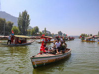 Indian security personnel patrol in a boat during an election rally at Dal Lake, ahead of the second phase of voting during the assembly ele...