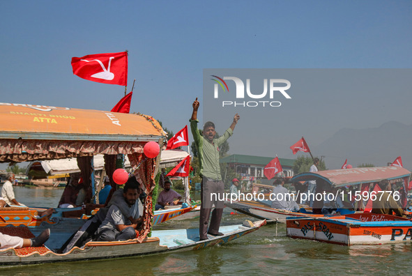 A supporter of the Jammu and Kashmir National Conference party (JKNC) shouts slogans during an election rally at Dal Lake, ahead of the seco...