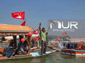 A supporter of the Jammu and Kashmir National Conference party (JKNC) shouts slogans during an election rally at Dal Lake, ahead of the seco...