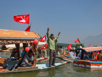 A supporter of the Jammu and Kashmir National Conference party (JKNC) shouts slogans during an election rally at Dal Lake, ahead of the seco...