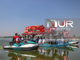 Omar Abdullah, the leader of Jammu and Kashmir National Conference (JKNC), right, Tanvir Sadiq, candidate of Jammu and Kashmir National Conf...