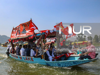 Omar Abdullah, the leader of Jammu and Kashmir National Conference (JKNC), right, during an election rally at Dal Lake, ahead of the second...