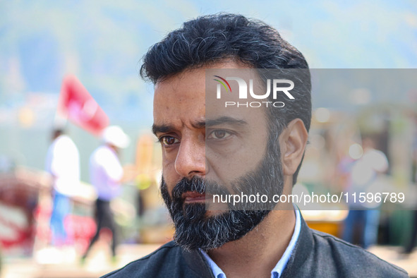 Member of Parliament and National Conference (NC) leader Aga Syed Ruhullah Mehdi looks on during an election rally at Dal Lake, ahead of the...