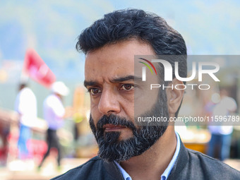 Member of Parliament and National Conference (NC) leader Aga Syed Ruhullah Mehdi looks on during an election rally at Dal Lake, ahead of the...