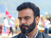 Member of Parliament and National Conference (NC) leader Aga Syed Ruhullah Mehdi looks on during an election rally at Dal Lake, ahead of the...